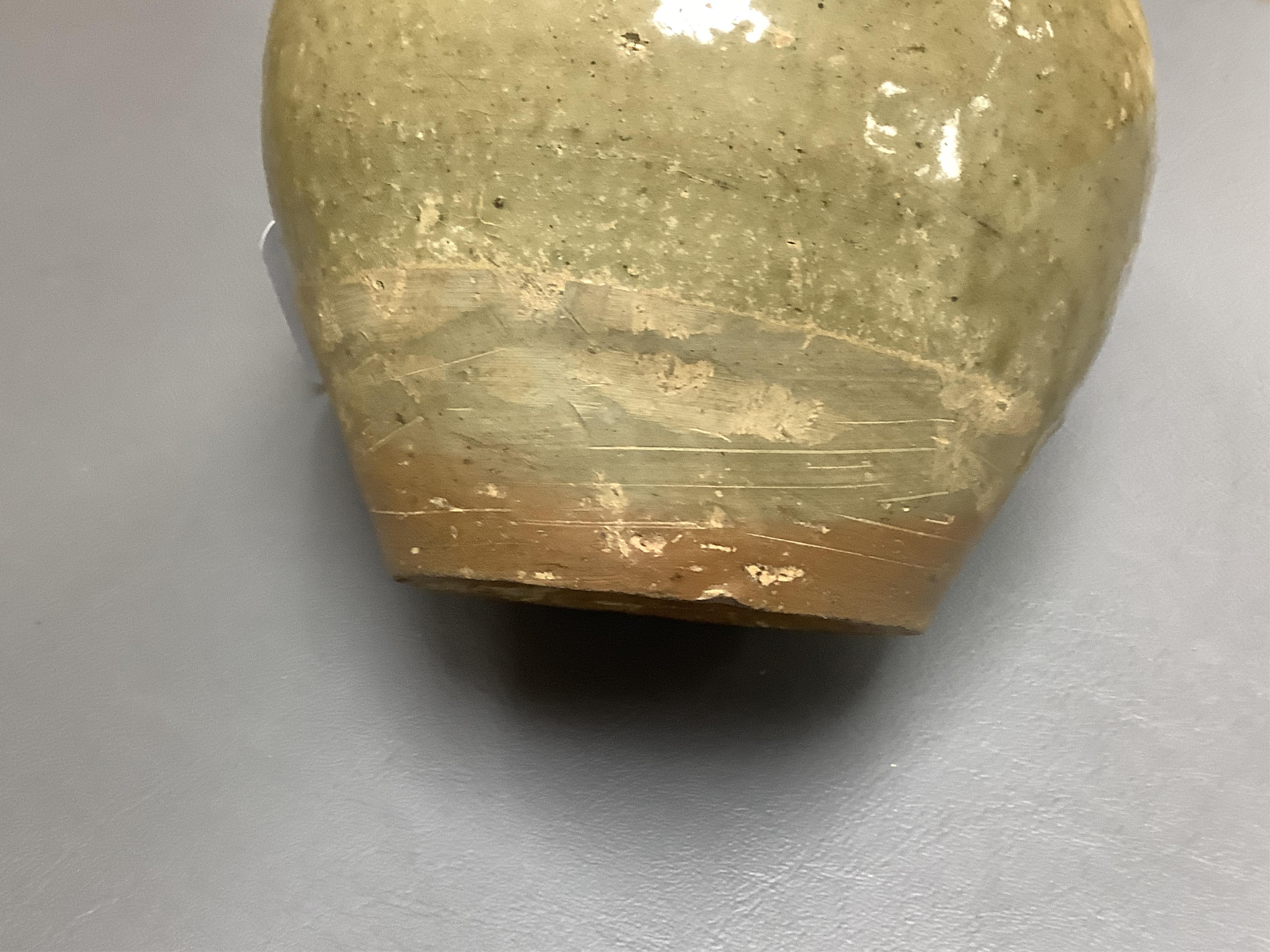 A Chinese olive green glazed jar, Tang Dynasty, 13cm